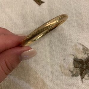 Engraved 14kT gold baby bangle.